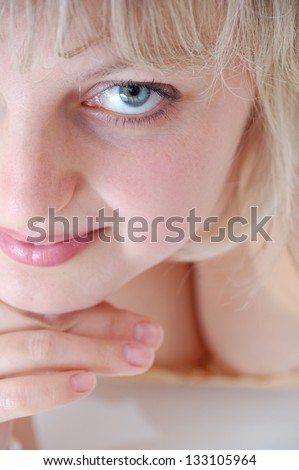 portrait of a young beautiful blond Caucasian woman looking back