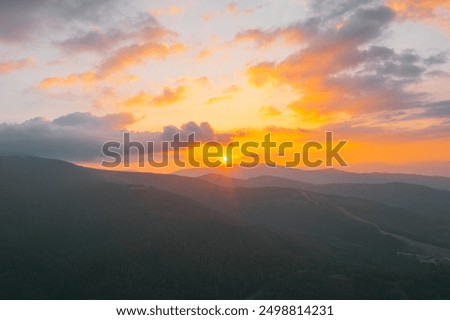 Similar – Image, Stock Photo Scenic sunset over peaceful sea and hilly shores