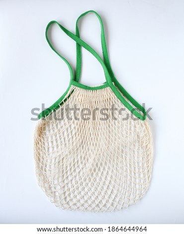 Similar – Image, Stock Photo eco net  tote bag for grocery shopping hanging on door knob at home near green leaves on houseplant