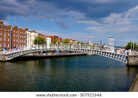 Dublin, Ireland. August 18, 2015. Ha\'penny Bridge over the River Liffey. Liberty Hall in the background