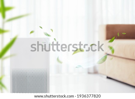 Air purifier on blue background with filter for cleaner removing fine dust PM2.5