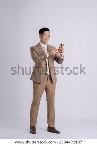 Similar – Image, Stock Photo Asian man standing on street