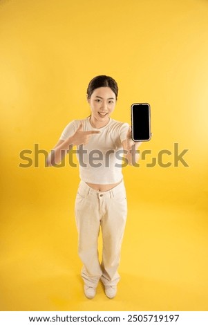 Similar – Image, Stock Photo Young woman holding yellow reusable bottle