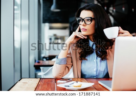 Young attractive woman looking away thoughtfully