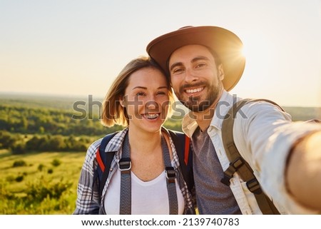 Similar – Image, Stock Photo young caucasian woman taking a picture of her golden retriever dog with mobile phone. Home, indoors