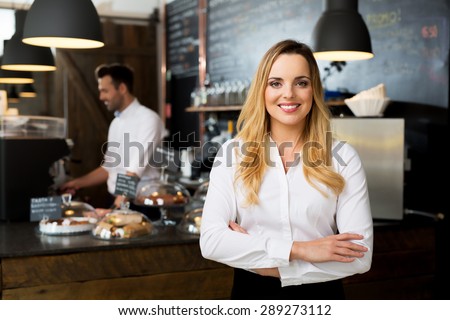 Successful restaurant manager, small business owner at work