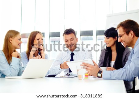 Happy business people during corporate meeting