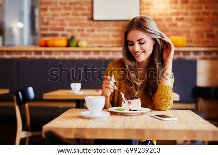 Similar – Image, Stock Photo Woman eating delicious cheesecake with jam