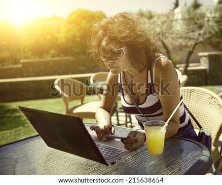Woman with ultrabook . applied tinting