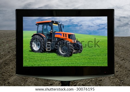 The TV on an arable land shows a green field