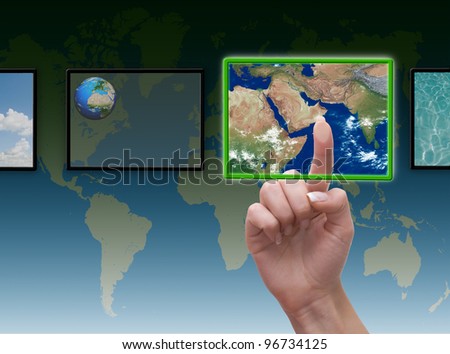 female hand pushing a button on a touch screen interface  \