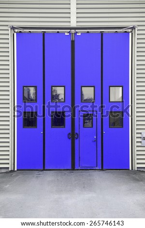 Blue Garage Door on a warehouse building