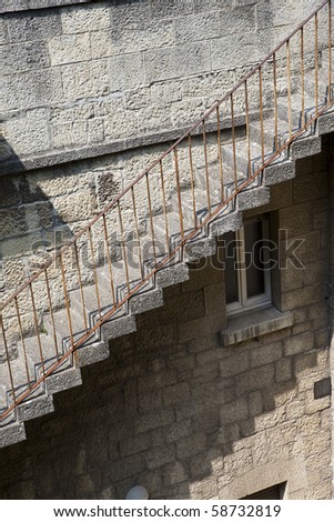 Worn stairs on a brick wall building
