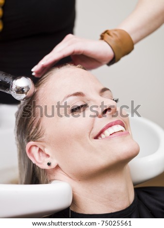 Laughing woman relaxing at the Beauty spa