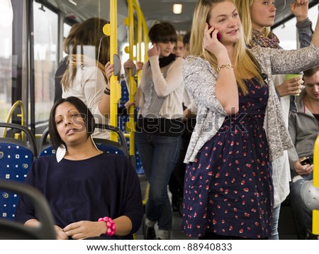 Woman sleeping while going by bus