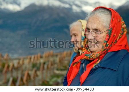 Two old women at the cemetery