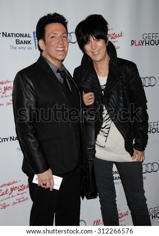 LOS ANGELES - DEC 5:  Diane Warren and Eric Vitro arrives at the I\'ll Eat You Last A Chat With Sue Mengers Opening Night  on December 5, 2013 in Westwood, CA