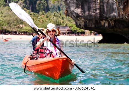KRABI, THAILAND - MAY 2: Unidentified ladies paddle the kayak at sea on May 2, 2015, in Krabi, Thailand