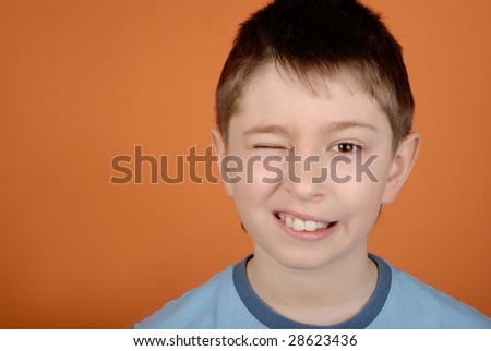Boy with the big teeth winks