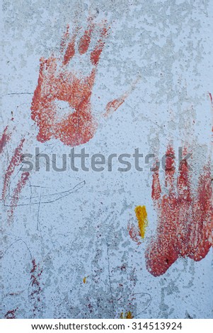 Hand print on concrete wall.