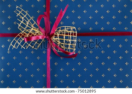 red with blue bow on a blue gift paper