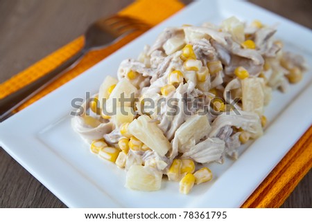 close-up fresh salad with chicken, pineapple and corn