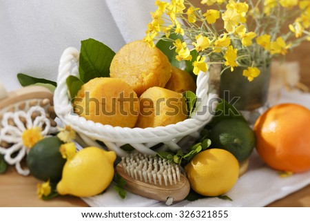 Handmade Natural Yellow Round Citrus Scented Soap in a Basket. Product Photography. Still Life.