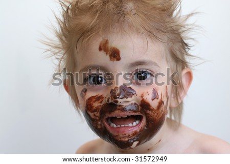 Baby with face covered in chocolate