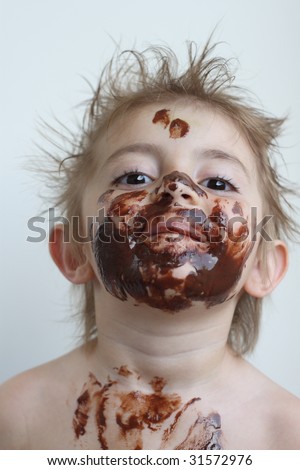 Baby with face covered in chocolate