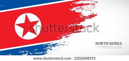 National flag of North Korea with textured brush flag. Artistic hand drawn brush flag banner background