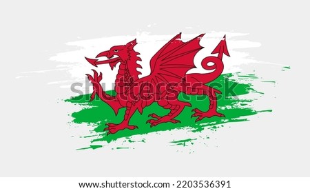 Hand drawn brush stroke flag of Wales. Creative national day hand painted brush illustration on white background