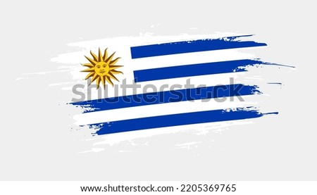 Hand drawn brush stroke flag of Uruguay. Creative national day hand painted brush illustration on white background