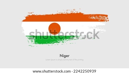 Brush painted grunge flag of Niger. Abstract dry brush flag on isolated background