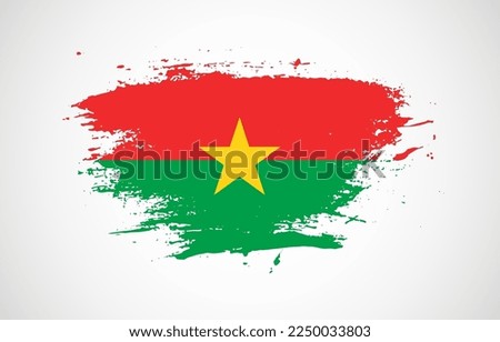 Grunge brush stroke with the national flag of Burkina Faso on a white isolated background