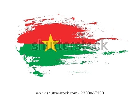 Grunge brush stroke flag of Burkina Faso with painted brush splatter effect on solid background