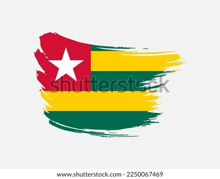 Stain brush painted stroke flag of Togo on isolated background