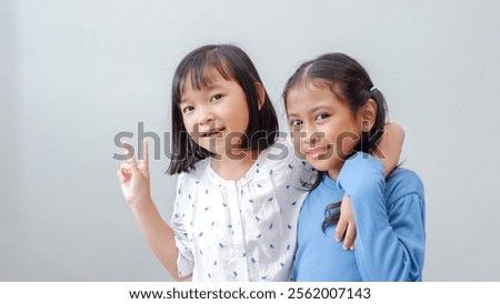 Similar – Image, Stock Photo Female palm with V-sign with rainbow bracelet