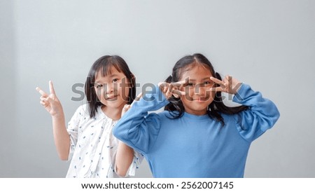 Similar – Image, Stock Photo Female palm with V-sign with rainbow bracelet