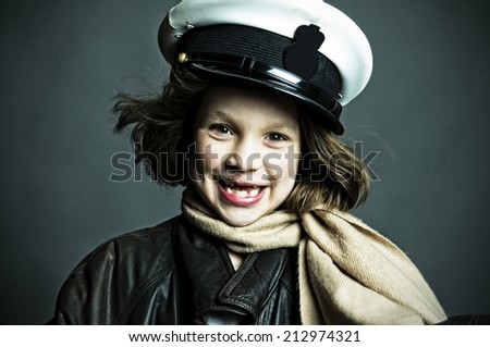 Gap-toothed girl in military cap