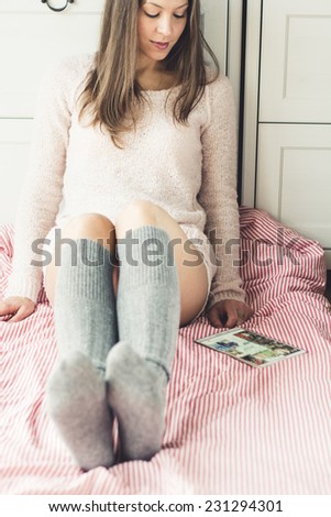woman on the bed with tablet