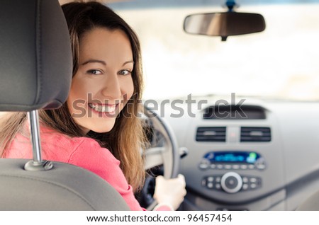 Woman Sitting In Car Getting Ready To Drive
