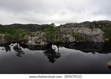 lake near Preikestolen\
Preikestolen or Prekestolen, also known by the English translations of Preacher\'s Pulpit or Pulpit Rock, is a famous tourist attraction in Forsand, Ryfylke, Norway.