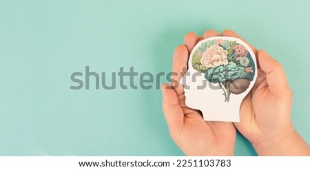 Hands holding paper head, human brain with flowers, self care and mental health concept, positive thinking Foto d'archivio © 