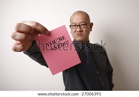 An unpleasant employer handing out a pink slip.