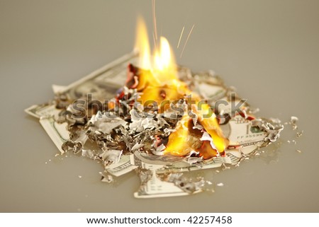 US hundred dollar bills on fire.