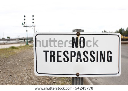 A No Trespassing Sign Next To Railroad Tracks. Stock Photo 54243778 ...