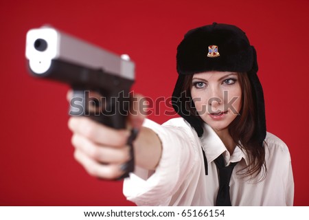 A young and sexy officer aiming gun