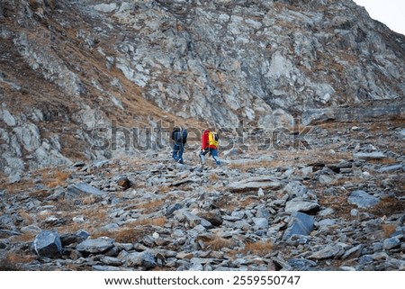 Similar – Image, Stock Photo Unrecognizable traveler walking up hill along road