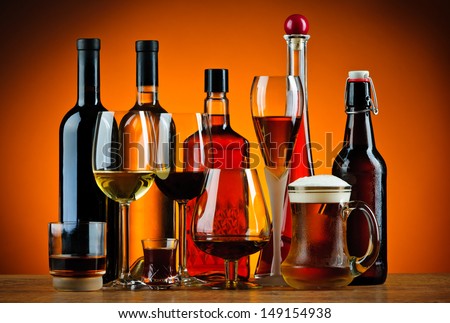 still life with various glasses and bottles of alcohol