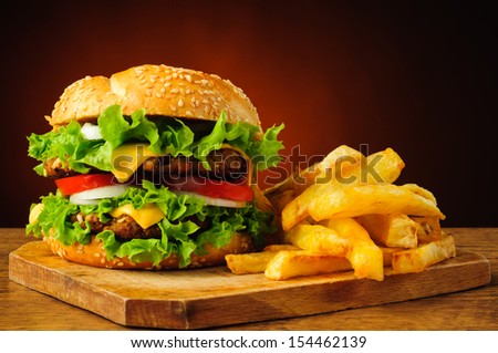 still life with traditional hamburger and french fries
